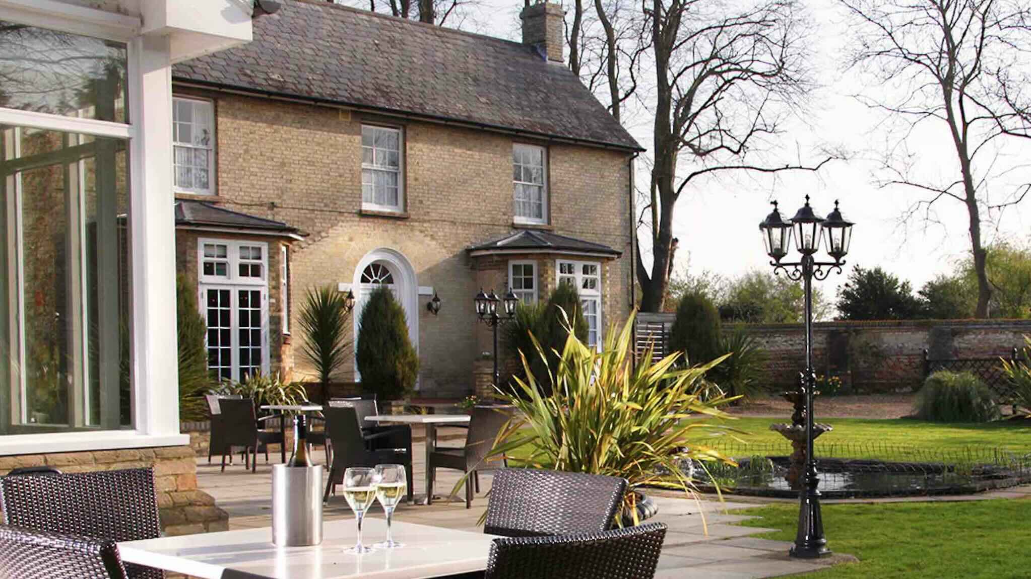 Grounds view with patio of Quy Mill Hotel & Spa one nof the best luxury hotels in Cambridge 