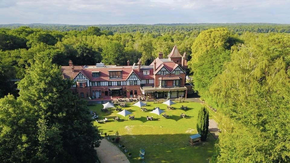 Rhinefield House Hote aerial view with New Forest in background