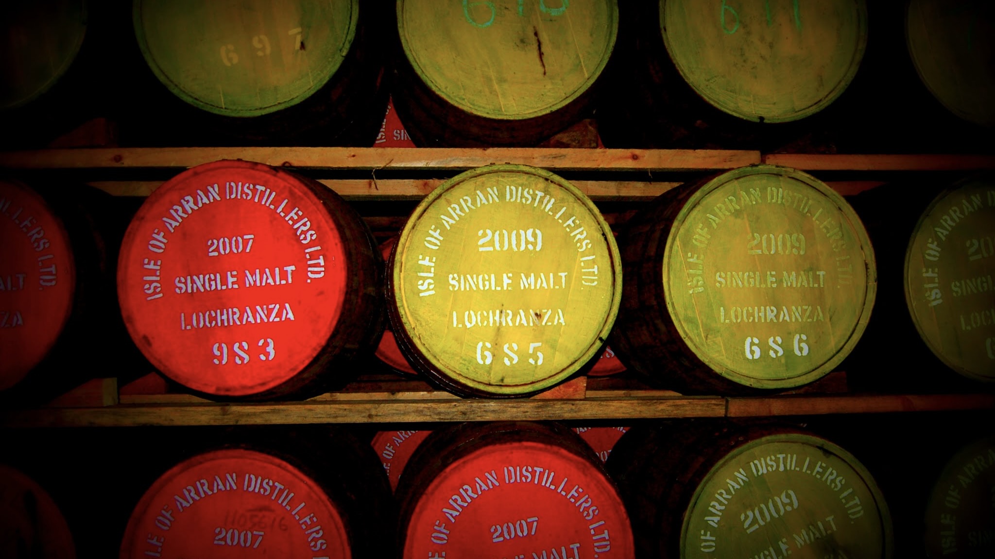 Arran Distillery barrels lined on shelf