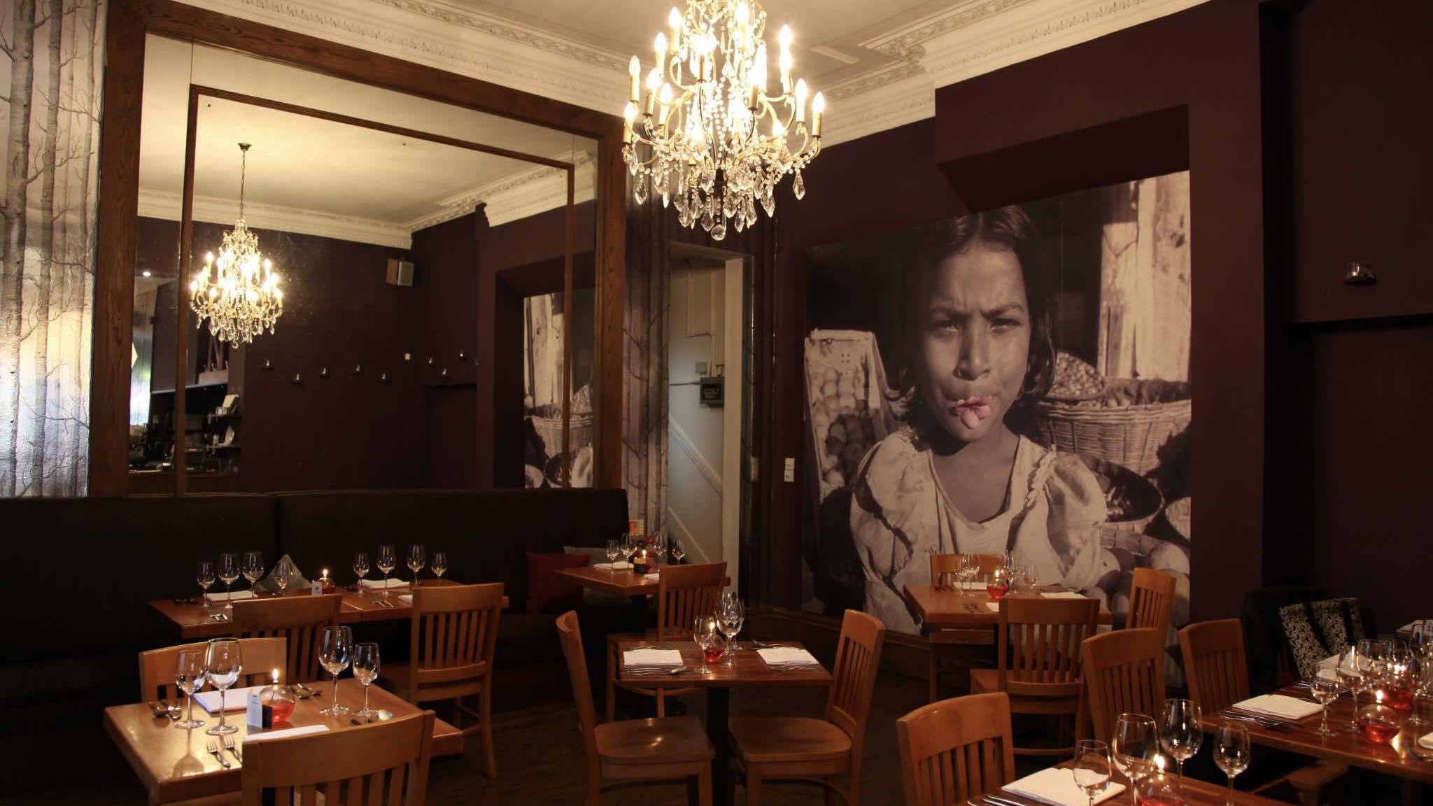 Indian Summer is one of the best brighton resraurants interior with tables and wall art