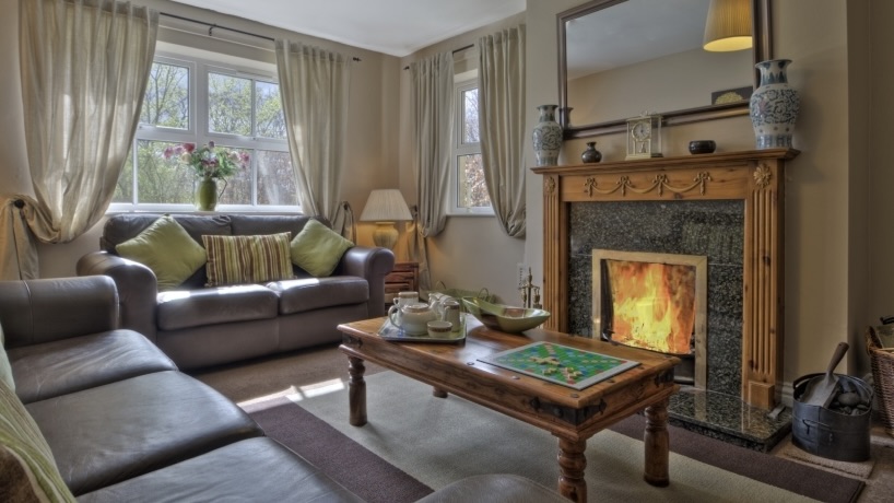 Chatton Park - The lodge sitting room with fireplacejpg
