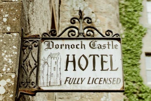 Dornoch Castle Hotel sign at one of th best boutique castles to stay in Scotland