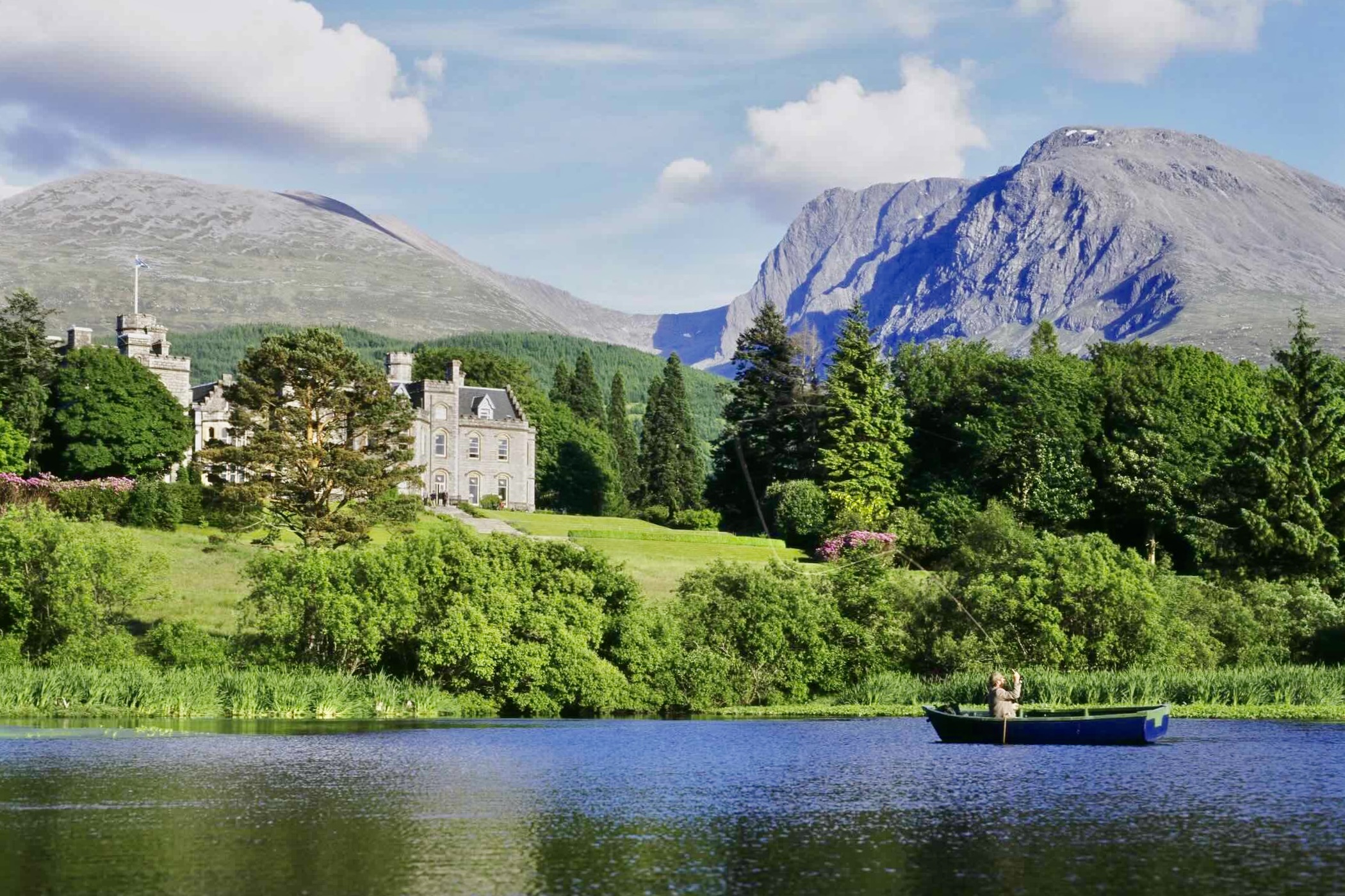 Inverlochy exterior from lake with Fisherman