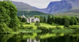 Inverlochy exterior from lake with mountains at one of the best 5-star castle hotels in Scotland