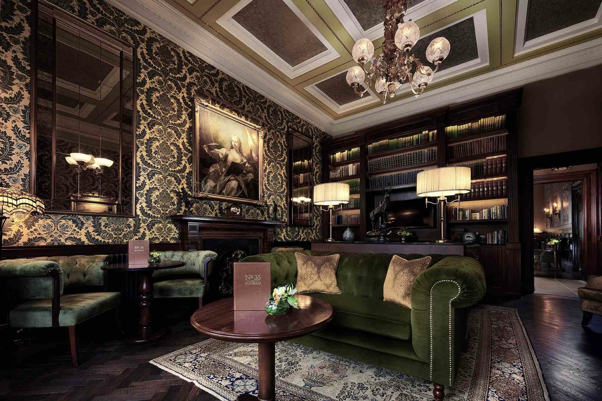 The Bonham Hotel bar and lounge with shelves and armchairs