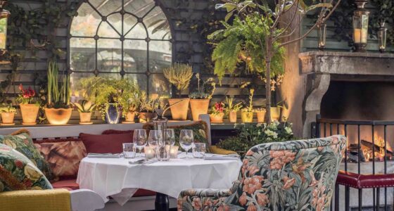 The-Ivy-Chelsea-Garden-Winter-Terrace-With table and fireplace at one of the best Posh restaurants in Chelsea Paul Winch-Furness - Photographer
