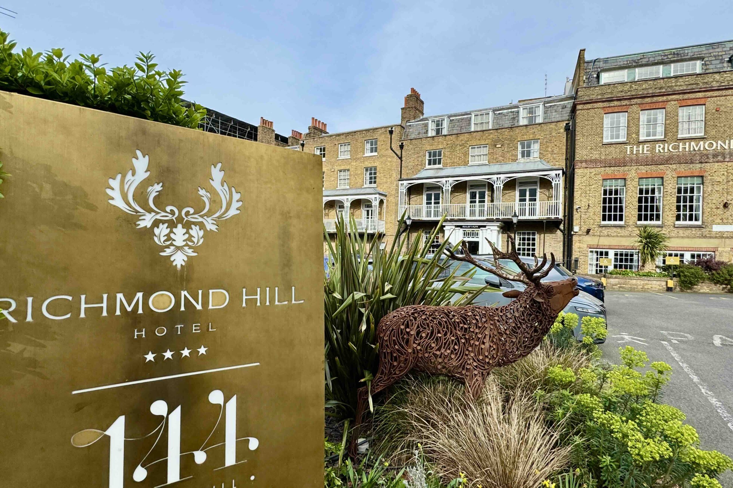 Richmond Hill Hotel exterior with deer and sign photo by Bryan Dearsley