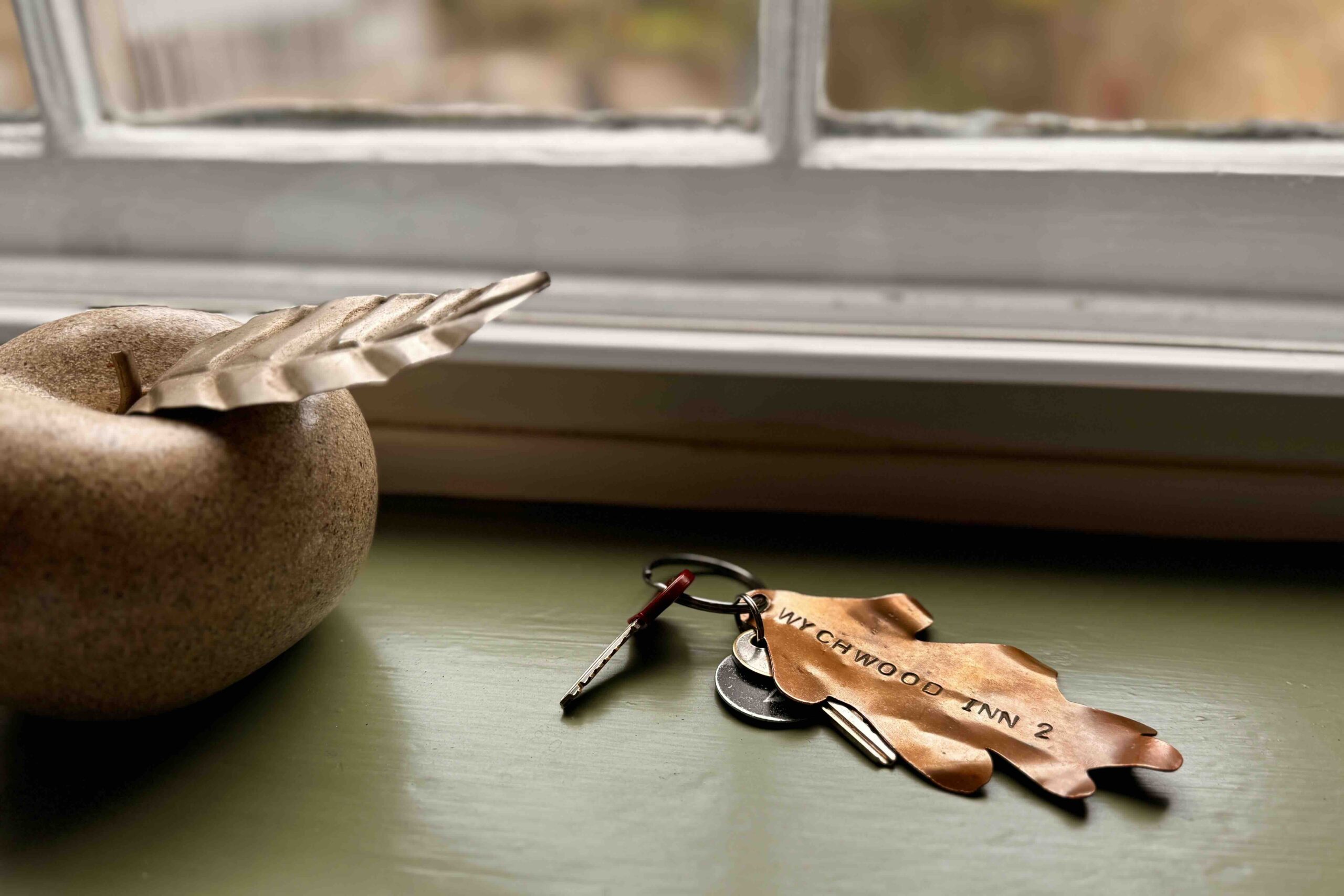 The Wychwood Inn key fob in window photo by Bryan Dearsley